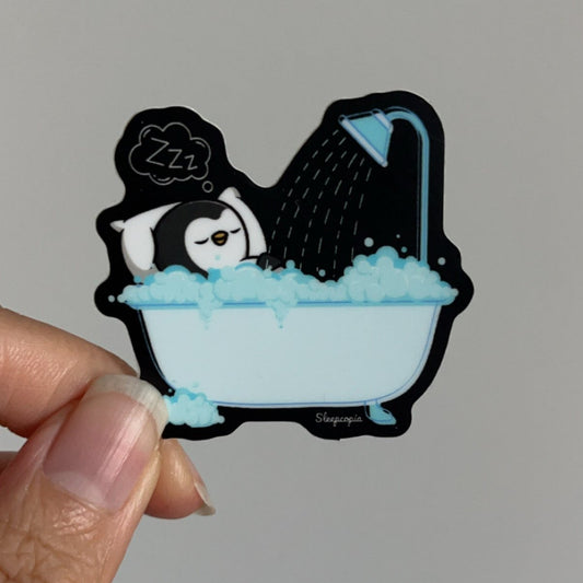 Sleepy Penguin in Bathtub